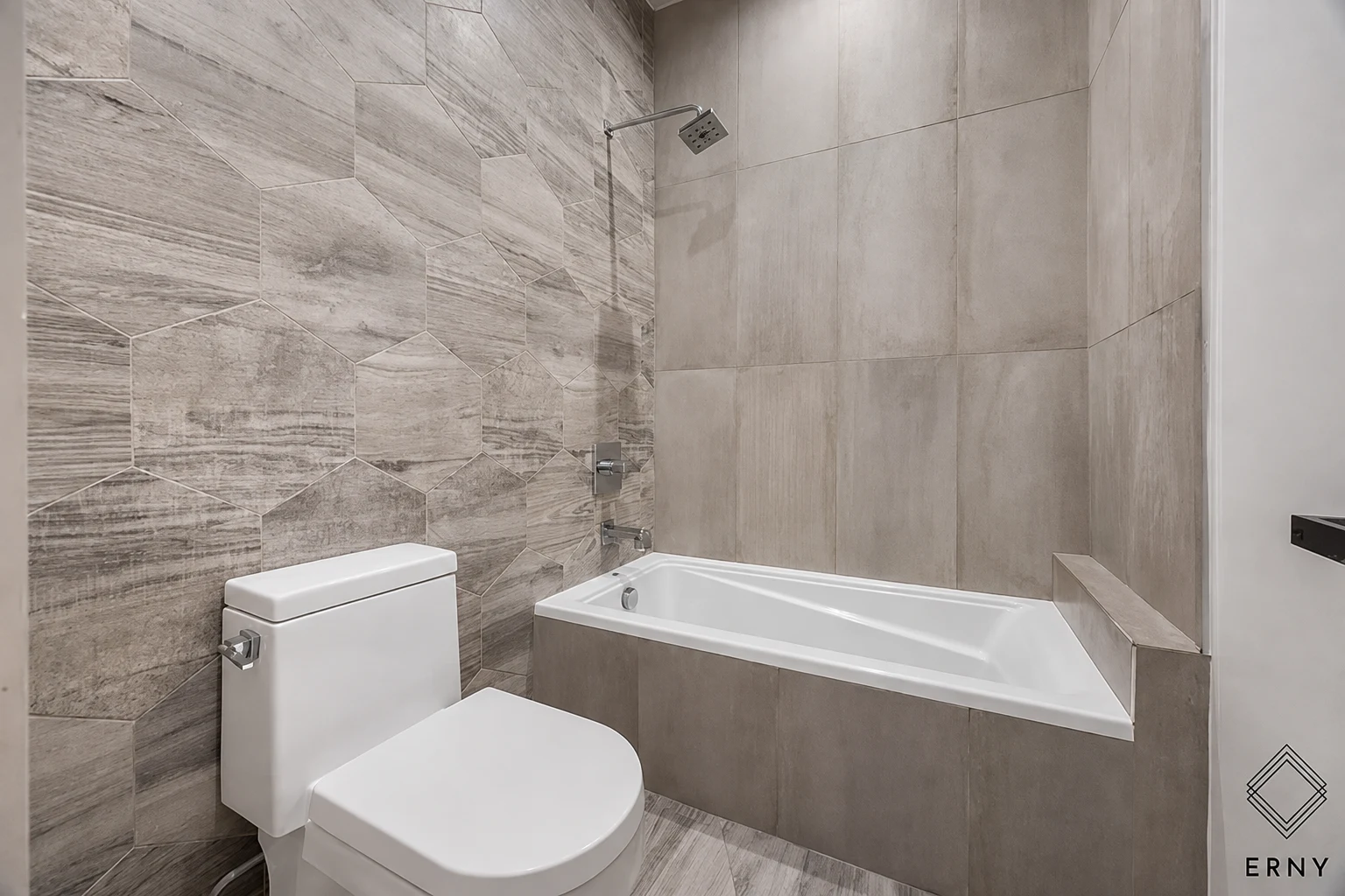 Alternate view of the finished bathroom and tub surround at 65 Whipple Street Apartment 2R