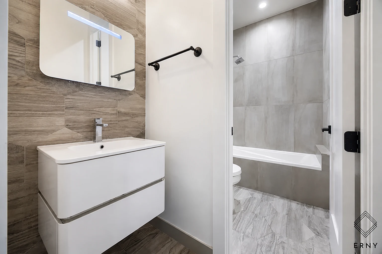 Finished bathroom vanity, tile and tub surround at 65 Whipple Street Apartment 2R