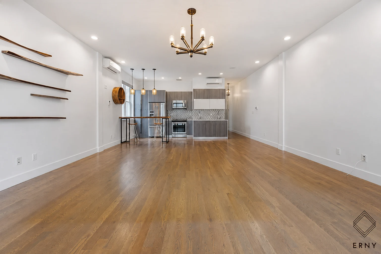 Wide view of the finished living area and kitchen at 65 Whipple Street Apartment 2R